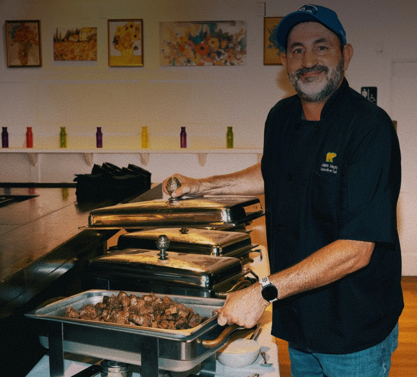 Chef Adam Mauro setting up the food during the grand opening of The Venue Clermont